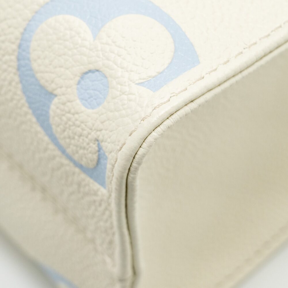 AAA Replica Louis Vuitton LV ONTHEGO PM BICOLOUR MONOGRAM EMPREINTE LATTE/CANDY BLUE GHW