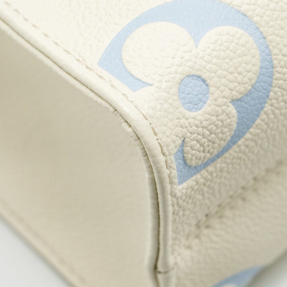 AAA Replica Louis Vuitton LV ONTHEGO PM BICOLOUR MONOGRAM EMPREINTE LATTE/CANDY BLUE GHW
