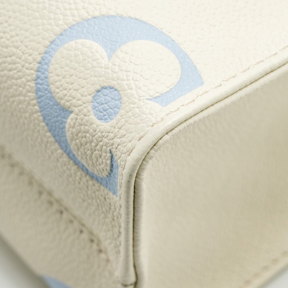 AAA Replica Louis Vuitton LV ONTHEGO PM BICOLOUR MONOGRAM EMPREINTE LATTE/CANDY BLUE GHW
