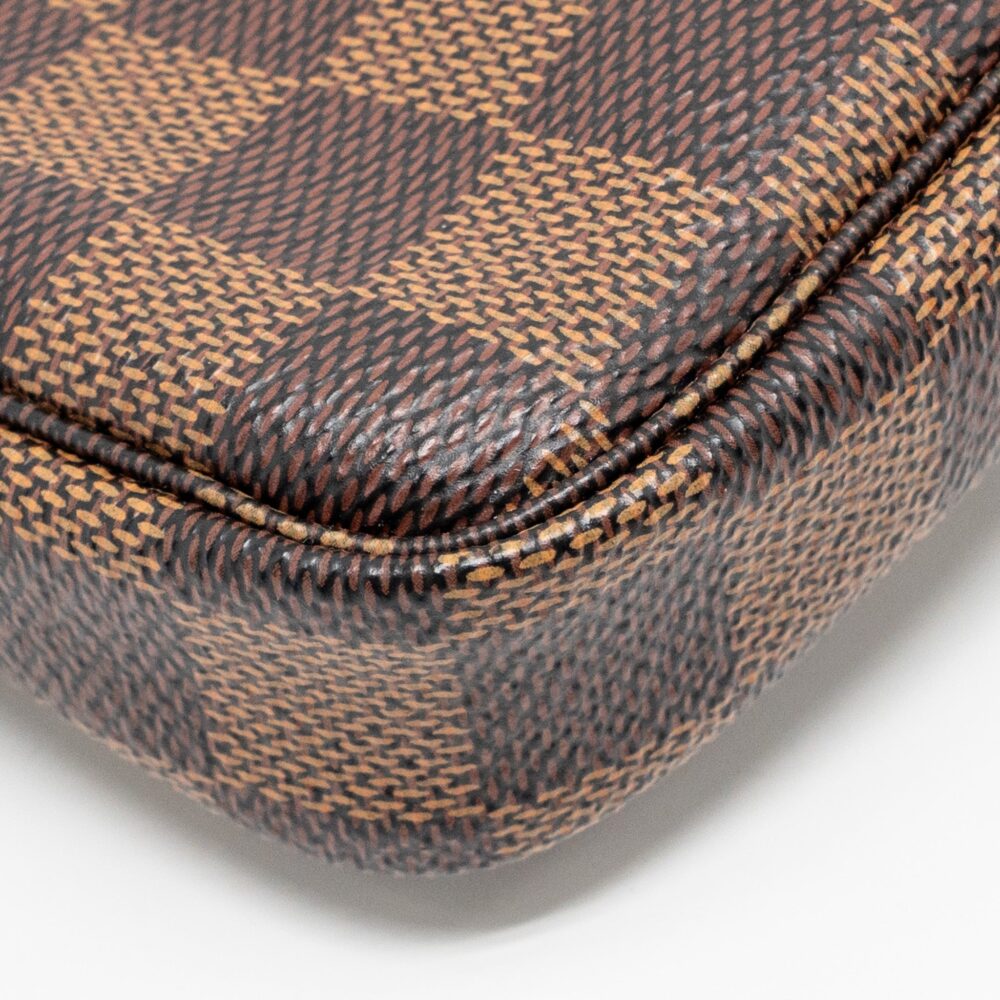 AAA Replica Louis Vuitton LV MINI POCHETTE ACCESSORIES DAMIER EBENE CANVAS GHW