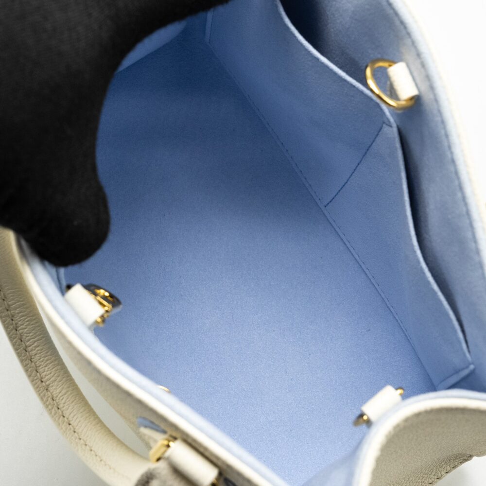 AAA Replica Louis Vuitton LV ONTHEGO PM BICOLOUR MONOGRAM EMPREINTE LATTE/CANDY BLUE GHW